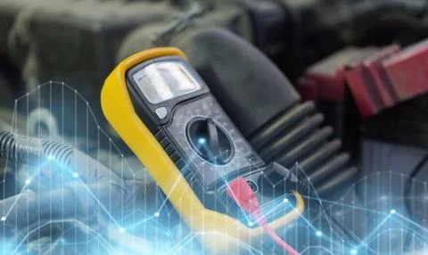 Multimeter or voltmeter testing car battery Stock Photos