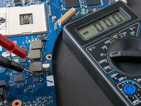 Multimeter test, electronic board of digital device with components Stock Photos