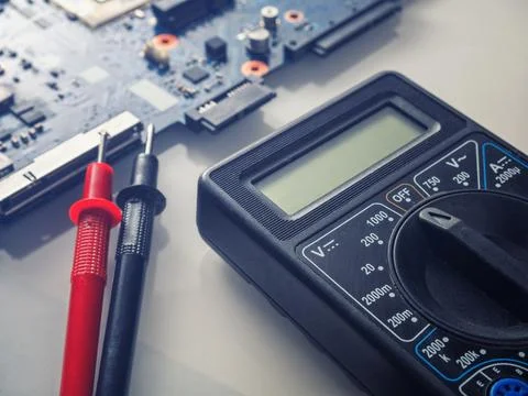 Multimeter test, electronic board of digital device with components Stock Photos