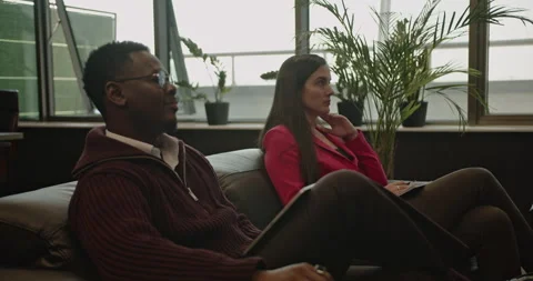 Multinational Business Team Engaged in a Presentation, Demonstrating Teamwork Stock Footage 313657224