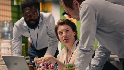 Multinational company work team collaborating on performance metrics Stock Footage 330100687