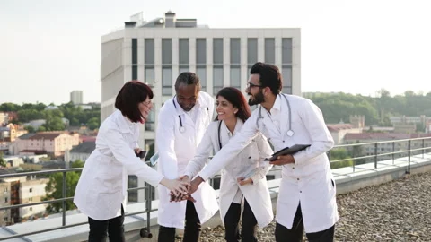 Multinational conference of doctors outdoors on rooftop of modern clinic. Stock Footage 262483473