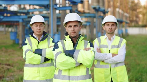 Multinational expert engineer team crossing their arms confidently, smart Stock Footage 194623988