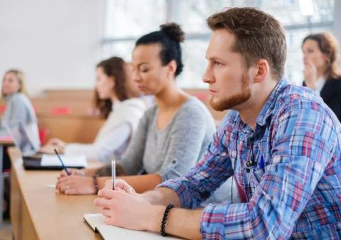 Multinational group of students in an auditorium Stock Photos