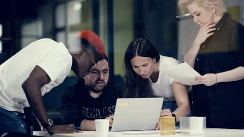 Multinational team of creative young people solve business problems in a meeting Video stock 140735857