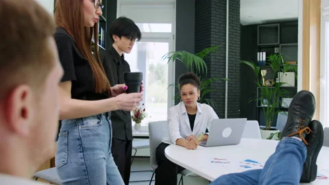 Multinational team during a brainstorming session in the office Stock Footage 195306074