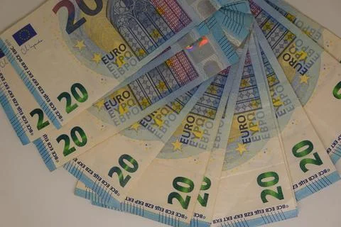 Multiple 20 euro banknotes forming a semi-circle on white background Stock Photos