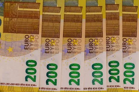 Multiple 200 euro bank notes in a close up shot Stock Photos