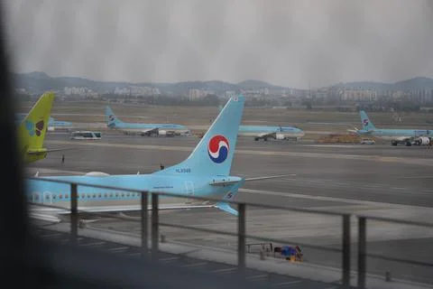 Multiple Airplanes Waiting to Takeoff Stock Photos