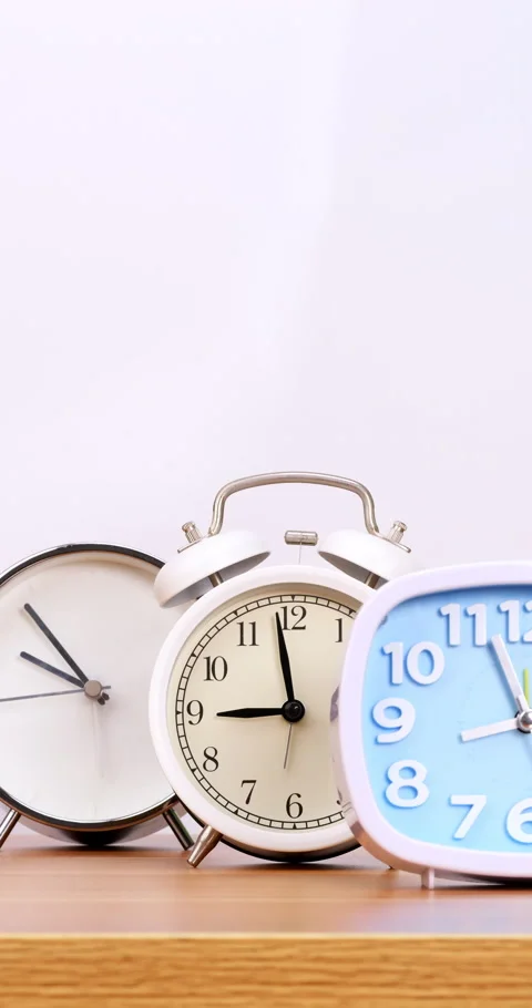 Multiple alarm clocks on white background. Stock Footage 246839297