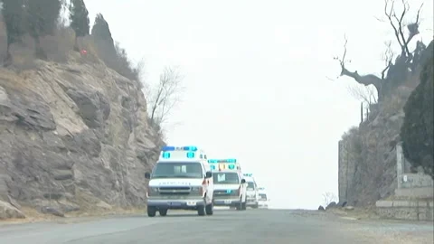 Multiple ambulances are coming from afar Stock Footage 253771398