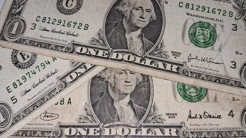 Multiple american one dollar bills featuring portraits of George Washington Stock Photos