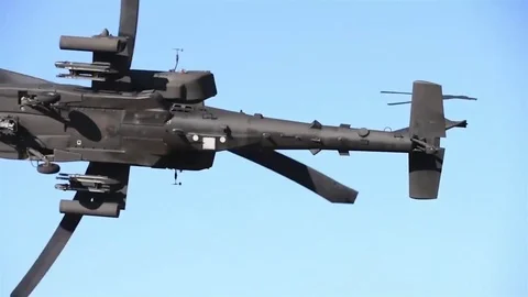 Multiple angles, US Army pilots prepares their AH-64 Apache to take off Stock Footage 83320567