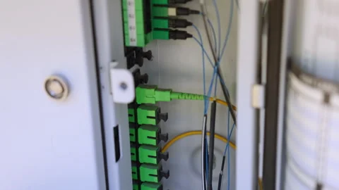 Multiple APC optical fiber connectors inside the DMARC Stockbeeldmateriaal 312358612