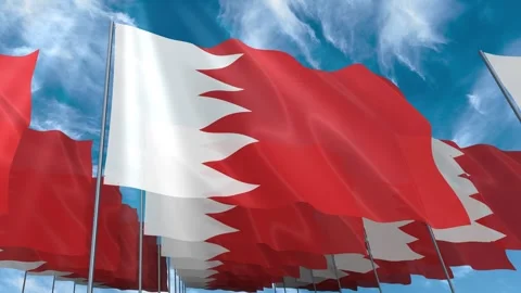 Multiple Bahrain flags seamless looping waving on blue sky Stock Footage 343676422
