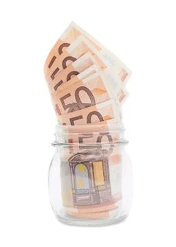 Multiple bank notes in a jar Stock Photos