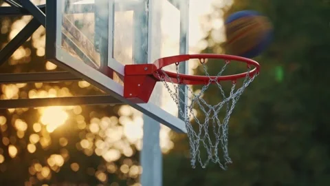 Multiple Basketballs Flying into Hoop at Sunset – Side Low Angle View Stock Footage 313808619