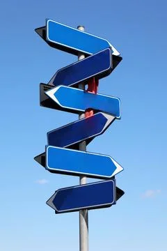 Multiple blank blue arrow signs pointing in various directions. Stock Photos