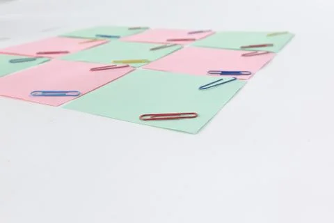 Multiple blank sheets for notes with paper clips isolated on white background Stock Photos