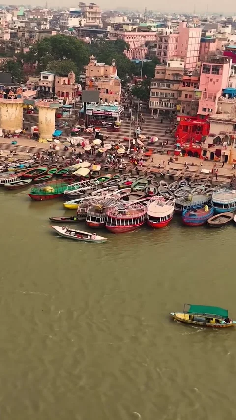 Multiple Boats Docked at Varanasi Riverfront at Sunrise (India Culture). Stock Footage 321610006