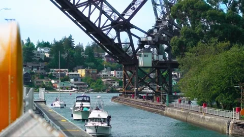 Multiple boats with people approaching under a raised bridge in Hiram M. Ch.. Stock-Footage 241377002