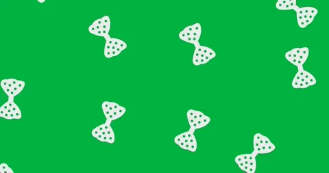 Multiple bow tie icons with polka dots pattern falling against copy space on 스톡 동영상 318338314