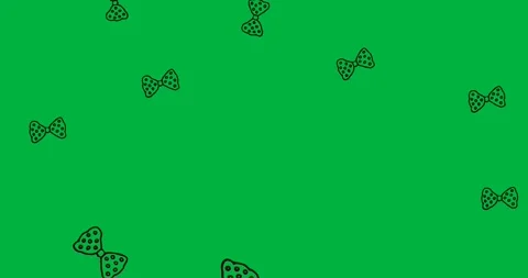 Multiple bow tie icons with polka dots pattern falling against copy space on Stock Footage 318338331