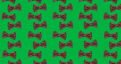 Multiple bow tie icons in seamless pattern against copy space on transparent Stock Footage 318338354