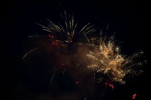 Multiple bright colorful fireworks explosion in the sky Stock Photos