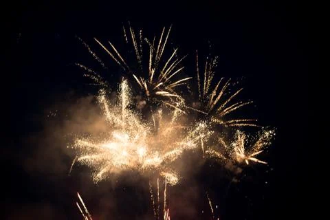 Multiple bright colorful fireworks explosion in the sky Stock Photos