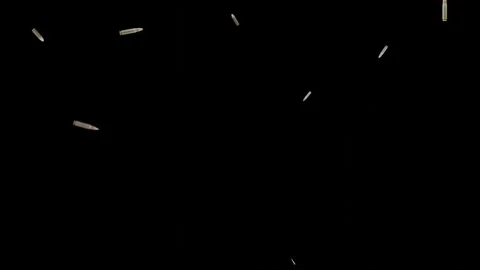 Multiple bullets flying against a stark black background Stock Footage 330062259
