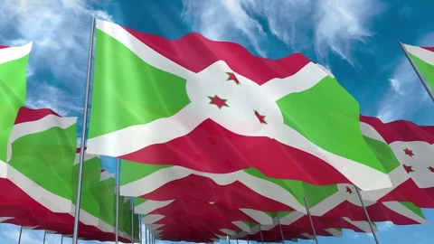 Multiple Burundi flags seamless looping waving on blue sky Stock Footage 343677578