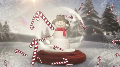 Multiple candy cane icons falling over snowman in a snow globe on winter Stock Footage 161473287