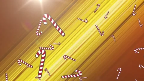 Multiple candy cane icons falling against spot of light and trails light on Stock Footage 162930534