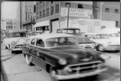 Multiple cars and bus passing on the busy streets of Atlanta - 1950 Stock Footage 105684150