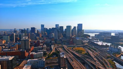 Multiple cars move by the roads in downtown Boston, Massachusetts, USA. Drone Stock Footage 338136589