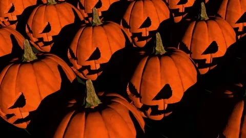 Multiple carved jack-o'-lantern pumpkins creating spooky Halloween atmosphere.  Video stock 315787607