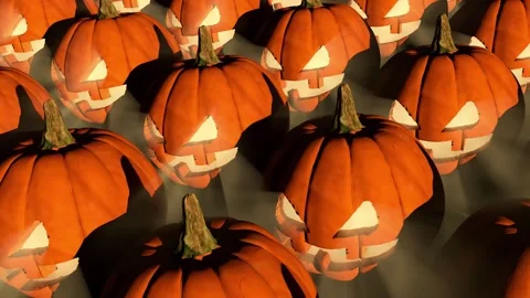 Multiple carved orange pumpkins with triangular eyes and scary expressions Stock Footage 315974918