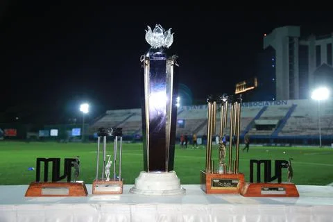 Multiple Champions trophy cup on sports stadium. Stock Photos