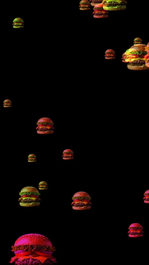 Multiple cheeseburgers float against a deep black background creating a sur.. Stock Footage 337738485