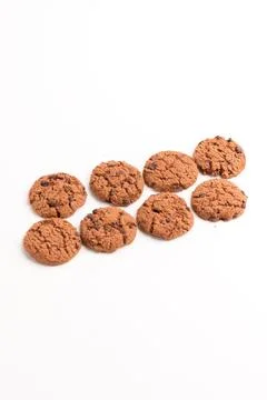 Multiple chocolate chip cookies arranged in rows flat lay isolated on a whi.. Stock Photos