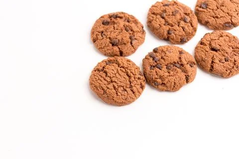 Multiple chocolate chip cookies arranged in rows flat lay isolated on a whi.. Stock Photos