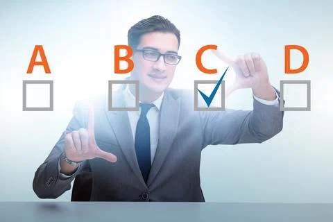 Multiple choice test question concept with business people Stockfoto's