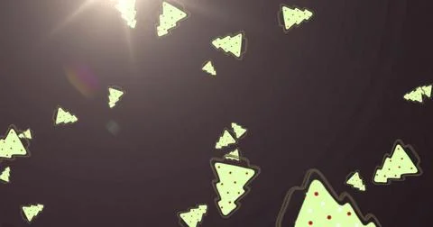 Multiple christmas tree icons falling against spot of light on grey background 스톡 일러스트