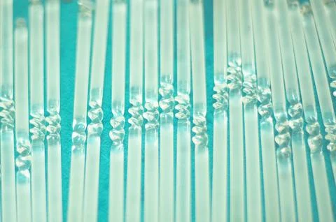 Multiple clear glass bars with a twisted bow in the middle. Foto stock