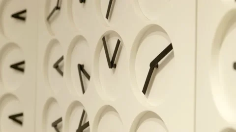 Multiple clocks rotating hands creating geometric pattern suspended on Stock Footage 233697479