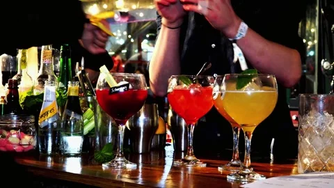 Multiple Close Up Shots Of Bar Staff Preparing and Serving Gin Cocktails Stock Footage 270368714