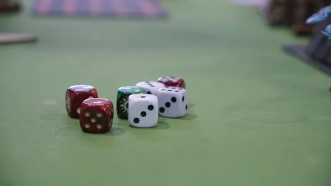 Multiple color dice on green table Stock-Footage 114004362
