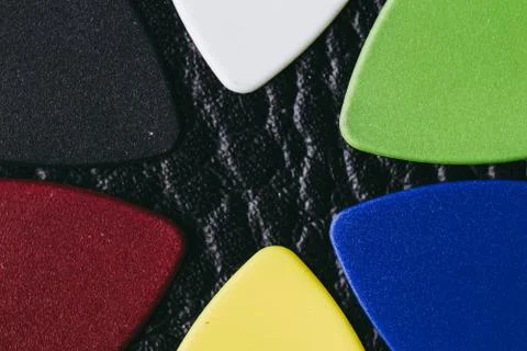 Multiple colored guitar picks Stock-Fotos