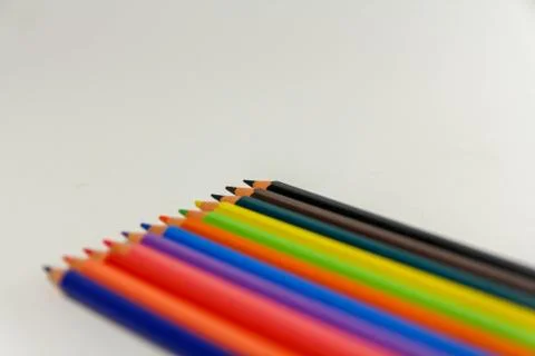 Multiple colored pencils on a white background. Stock Photos